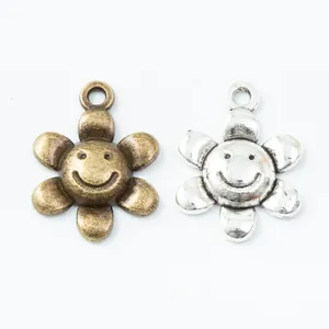 Ciondoli girasole vintage con sorrisi in bronzo e argento per creazione gioielli fai-da-te