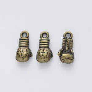 Vintage bronze boxing glove pendant with cross engraving and Burden of Proof text