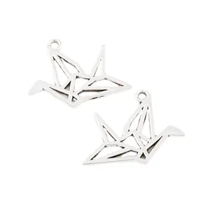 Vintage silver zinc alloy origami crane pendant charms with hollow geometric design for DIY