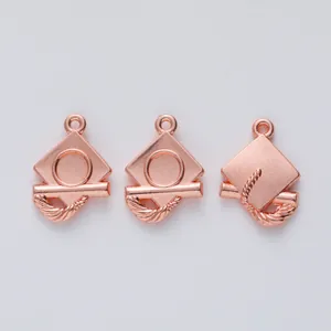 Three rose gold graduation cap alloy charms for DIY jewelry making displayed on white background