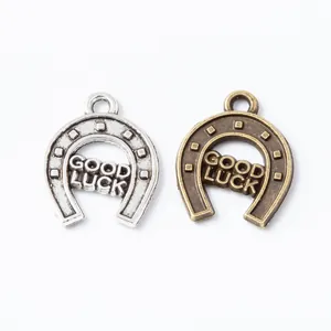 Vintage horseshoe lucky charms in antique silver and bronze for DIY jewelry crafting