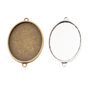 Base per pendente ovale in lega bronzo antico e argento con due asole per gioielli DIY
