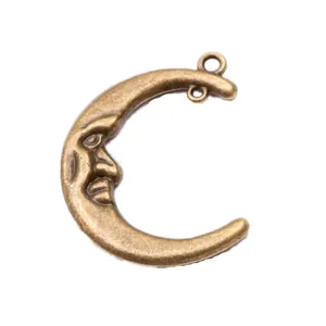 Ciondoli vintage a mezzaluna in bronzo con viso e doppi anelli per creazione di gioielli
