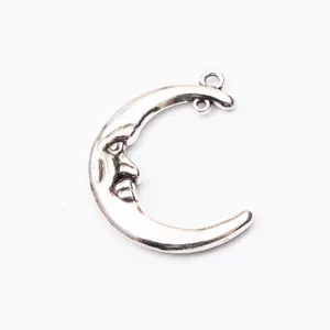 Ciondolo a mezzaluna d'argento vintage con viso per creazione di gioielli fai da te
