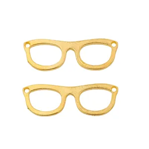 Detailed macro view of vintage gold zinc alloy glasses charms for DIY jewelry making