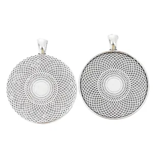 Pair of vintage 35mm round zinc alloy bezel trays with geometric mesh pattern