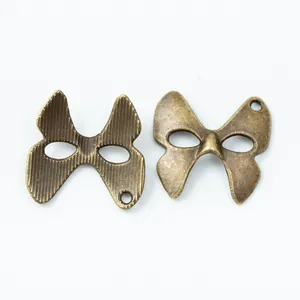 Colgantes de máscara de mariposa de bronce vintage para accesorios de joyería DIY