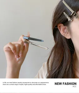 Detail of silver and blue metal hair clips with non-slip texture on a hair strand