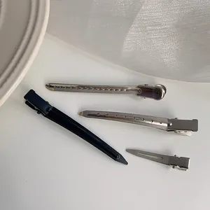 Hair root volumizing clips and duckbill styling hairpins in black and silver finishes