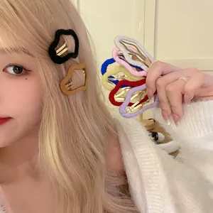 Plush cloud-shaped hair clips in various colors shown on a model for winter styling