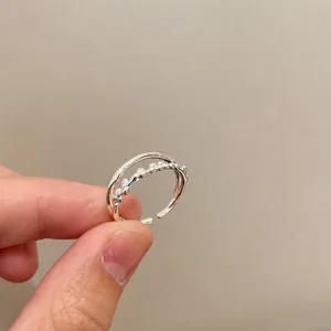 Minimalist silver double-layered open ring with beaded accents and adjustable band