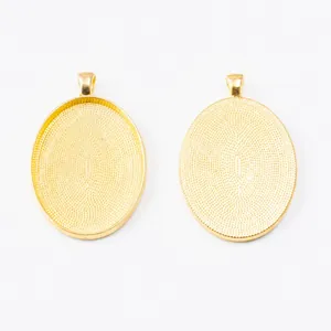 Detailed front and back view of 30x40mm oval gold alloy pendant base for DIY jewelry