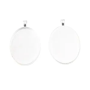 Silver oval alloy pendant tray for DIY jewelry making with textured base and hanging hole