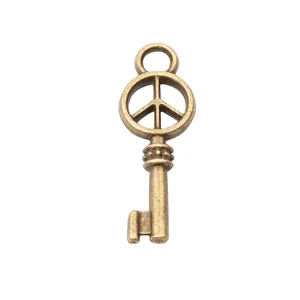 Pendentif clé vintage en alliage de bronze avec signe de paix pour bijoux DIY