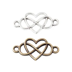 Connettori a cuore infinito in argento e bronzo antico per creazione gioielli fai da te