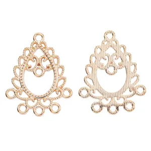 Macro view of teardrop alloy pendants with vintage hollow patterns and five hanging loops