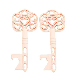 Macro detail of rose gold vintage key bottle opener with intricate floral filigree