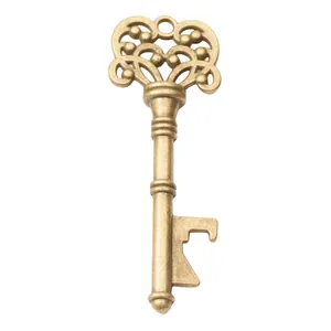 Vintage bronze key-shaped bottle opener with ornate heart-patterned metal handle
