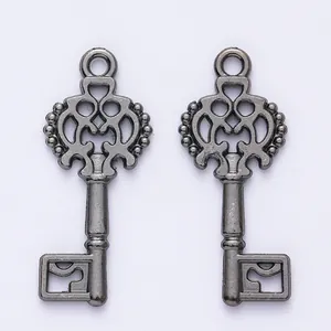 Detailed macro view of vintage alloy key charms with intricate crown hollow patterns
