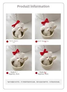 Detailed views of bear hair clips with red bows in sizes four to six centimeters