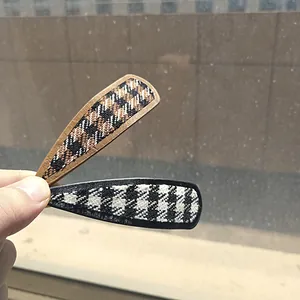Classic houndstooth fabric hair clip set including warm brown and black white patterns