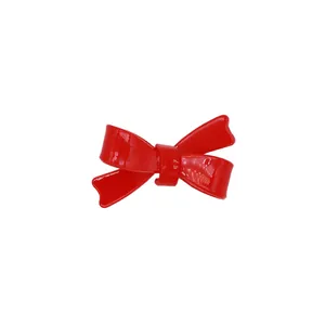 Vintage red bow hair clip with glossy finish for a sweet and elegant aesthetic style