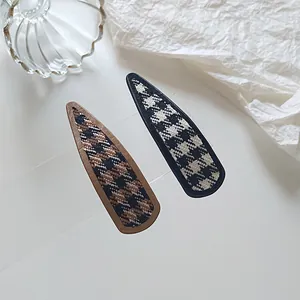 Retro houndstooth fabric snap hair clips in brown and black drop-shaped design