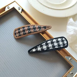Classic houndstooth tweed snap hair clips for women in elegant brown and black tones