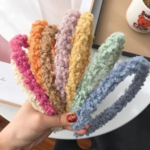 Colorful plush lamb wool headbands set in various soft pastel colors for winter