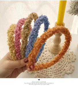 Close-up of assorted colorful teddy fleece headbands with soft plush texture in five colors