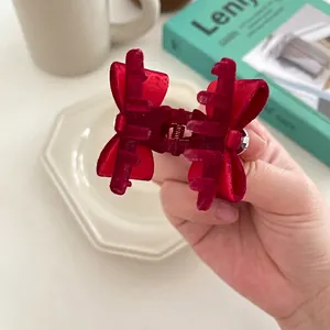Vintage red velvet bow hair claw clip for women featuring elegant rhinestone accents