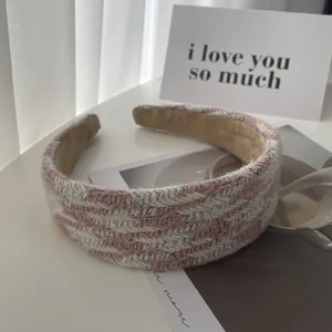 Chic pink herringbone tweed wide sponge headband for a high cranial top hairstyle look