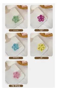 Detailed grid view of flower hair clips in green, rose red, blue, yellow, and pink colors