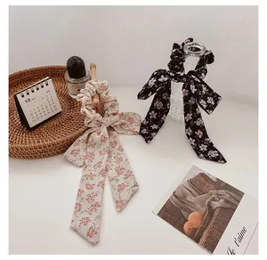 Floral bow scrunchies set with long ribbons in creamy white and black chiffon fabric