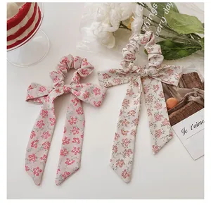 Floral print bow scrunchie set with long ribbons in soft pink and cream fabric patterns