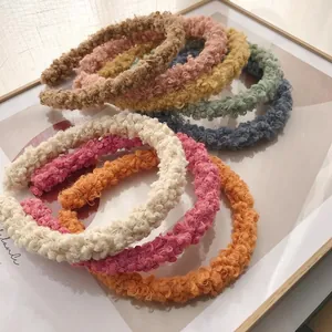 Colorful lamb wool headbands with curly texture in various trendy pastel colors