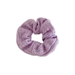 Knitted lavender hair scrunchie with soft honeycomb texture for sweet autumn hairstyles
