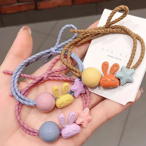 Lot de trois chouchous élastiques lapin dessin animé en marron, bleu et rose