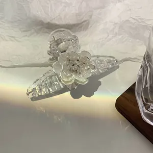 Elegant large transparent hair claw clip featuring a 3D floral design with rainbow lighting