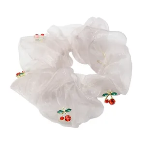 Light pink organza scrunchie with sparkling cherry rhinestone pendants and mesh texture