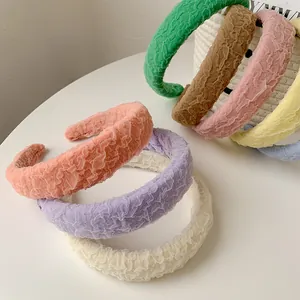 Detail of wide padded mesh headbands showing pleated fabric texture and diverse candy colors