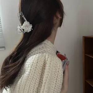Elegant white floral hair claw clip with pearl luster and crystals for half-up hair