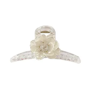Elegant large translucent hair claw clip with white floral 3D design and gold accents