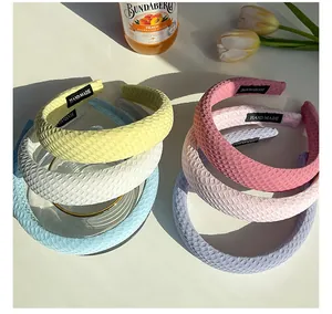 Detail of handmade padded headbands with waffle texture in colorful macaron shades