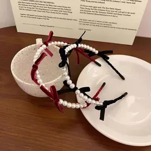 Elegant vintage pearl headband with velvet bows in red and black colors for women