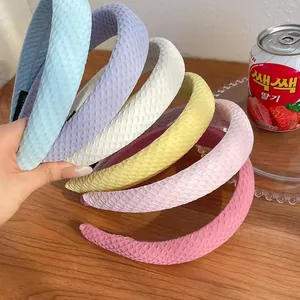 Colorful padded headbands with honeycomb texture in blue, purple, and yellow shades