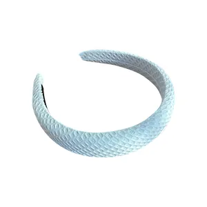 Sky blue padded headband with woven waffle texture for a trendy summer hair accessory look