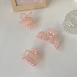 Set di tre fermagli per capelli rosa traslucidi a forma di farfalla e a onde