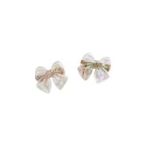 Iridescent mermaid bow earrings in translucent resin with colorful gradient effect