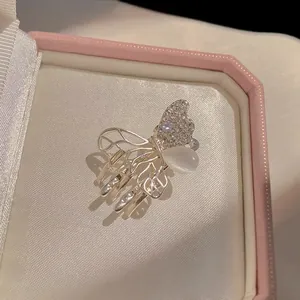 Elegant silver butterfly hair claw clip with cat eye stone and sparkling crystals